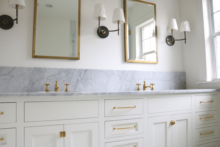 Bright bathroom remodel with white vanity and glass shower